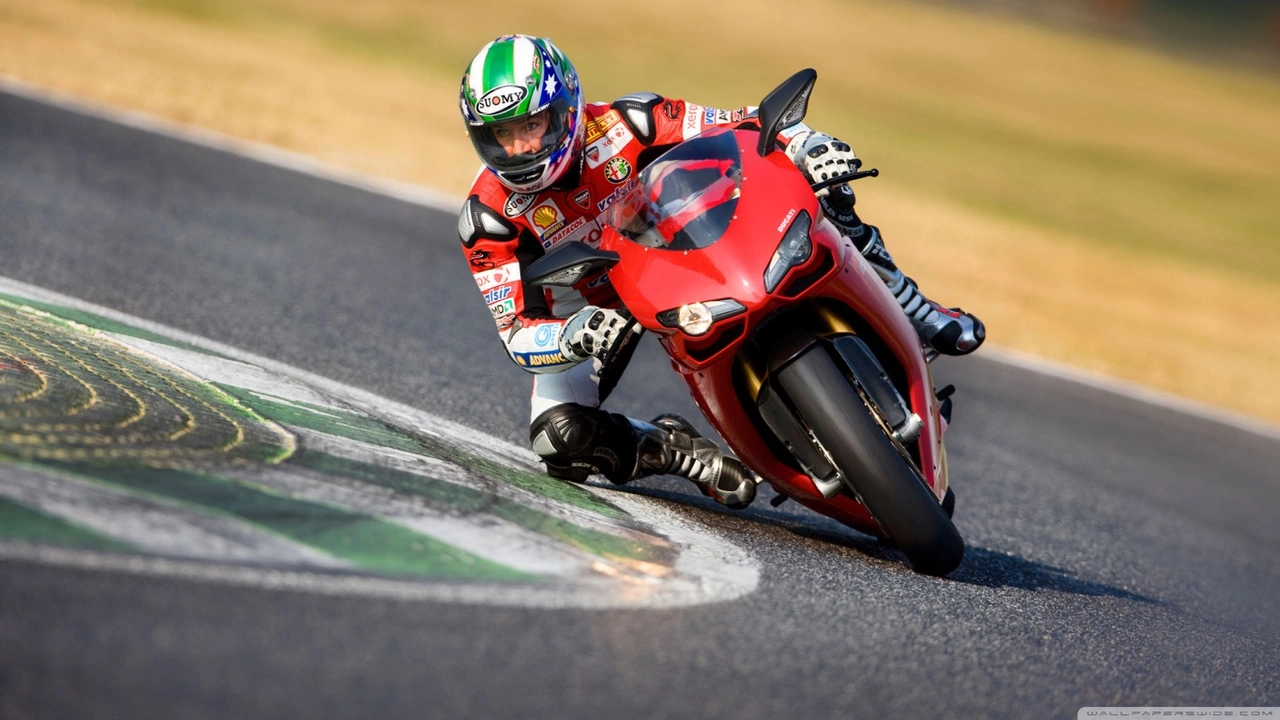 How do motorcycle racers lean so far without tipping over?